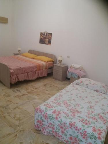A bed or beds in a room at I Nuovi Orizzonti Casa Girasole