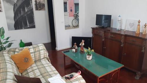 a living room with a couch and a coffee table at Vista Funchal in Funchal
