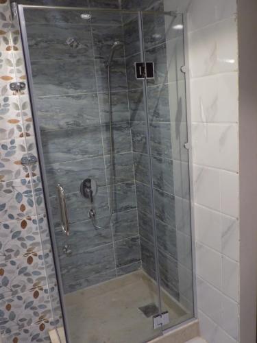 a shower with a glass door in a bathroom at Jewel Sharm El Sheikh Hotel in Sharm El Sheikh