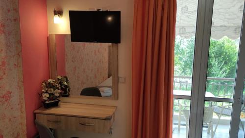 TV a/nebo společenská místnost v ubytování Gogo's - Γωγώ Rooms & Studios