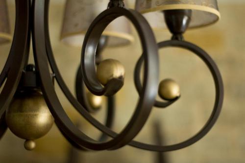 a close up of a chandelier with bells at La Posada de las Casitas in Ampudia