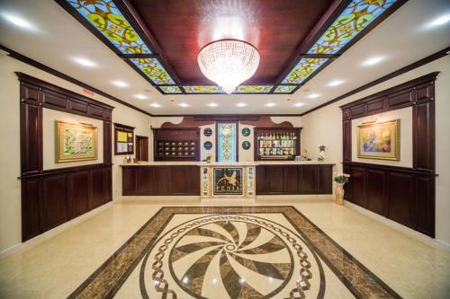 a large room with a ceiling with a stained glass window at Fenix in Vinnytsya