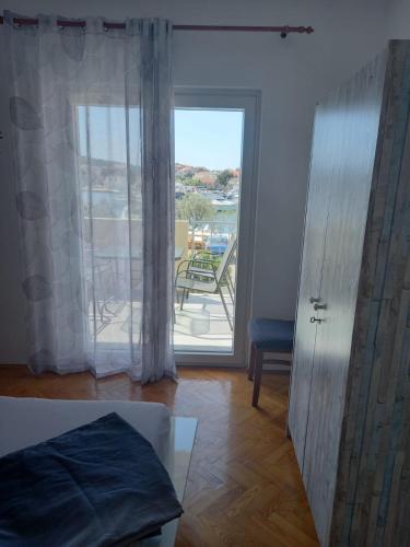 Ένα ή περισσότερα κρεβάτια σε δωμάτιο στο Apartman Rebeka