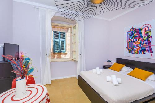 Postel nebo postele na pokoji v ubytování Cap Rooms
