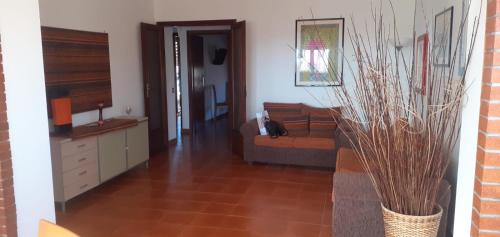 a living room with a couch and a table at Appartamento Marina D’Ardea vista mare in Ardea