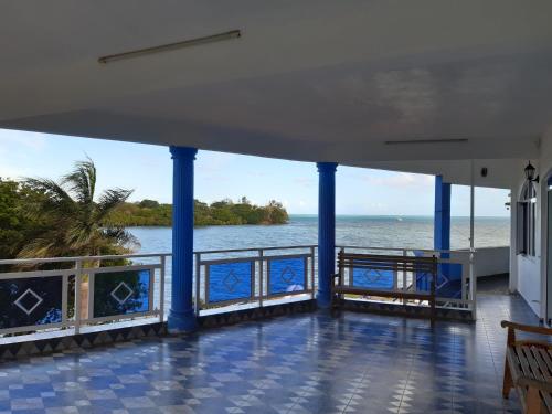 a view of the water from the balcony of a cruise ship at Family Residence in Grande Rivière Sud Est