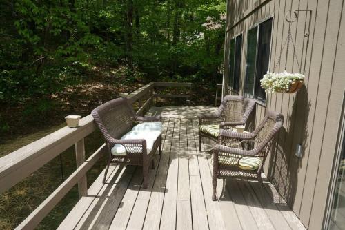 two chairs and a table on a porch at 4BD 2BA - Mount Snow VT - Ski-Back Trail - Shuttle in Dover