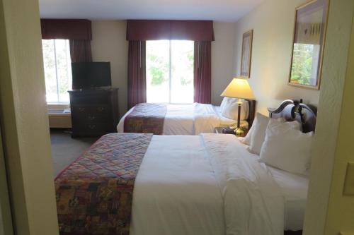 Ένα ή περισσότερα κρεβάτια σε δωμάτιο στο Hawthorn Extended Stay by Wyndham Seville