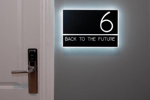 a door with a sign that reads back to the future at Trueman Court Luxury Serviced Apartments in Liverpool