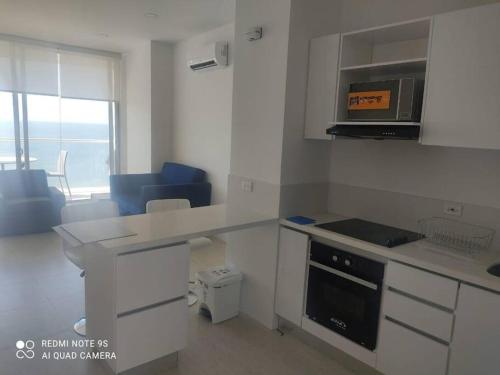 Кухня или мини-кухня в Magnifico apartamento con vista y salida al mar
