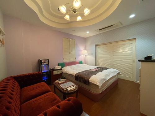 Postel nebo postele na pokoji v ubytování HOTEL マナティ
