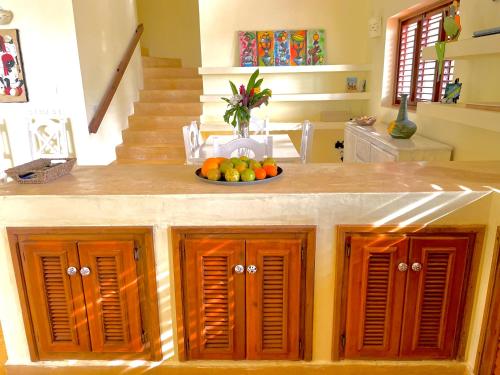 a kitchen with a bowl of fruit on a counter at Bella Vista in Las Terrenas
