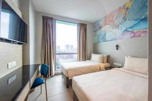 a hotel room with two beds and a large window at ibis Styles Singapore Albert in Singapore