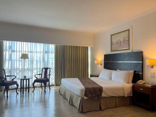 Postel nebo postele na pokoji v ubytování Days Hotel by Wyndham Iloilo