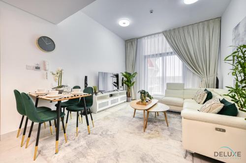 a living room with a table and chairs and a couch at Urban 1BR at Binghatti Stars Dubai Silicon Oasis by Deluxe Holiday Homes in Dubai