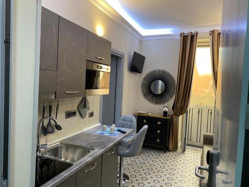 a kitchen with a sink and a counter top at The world suite in Tropea