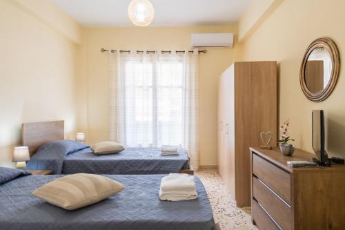 Postel nebo postele na pokoji v ubytování Cozy Platytera apartment