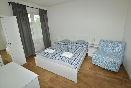 Postel nebo postele na pokoji v ubytování Apartmány u Pešlů