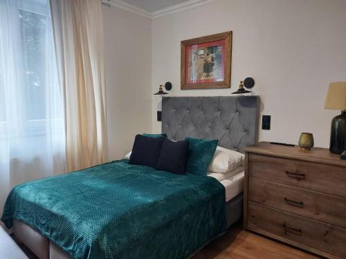 Posteľ alebo postele v izbe v ubytovaní 4 STRONY ŚWIATA Pokoje i Apartamenty