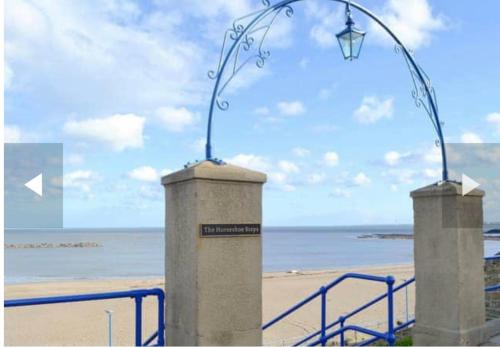 a street light in front of the beach at THE CARRIAGE HOUSE in Woodhorn