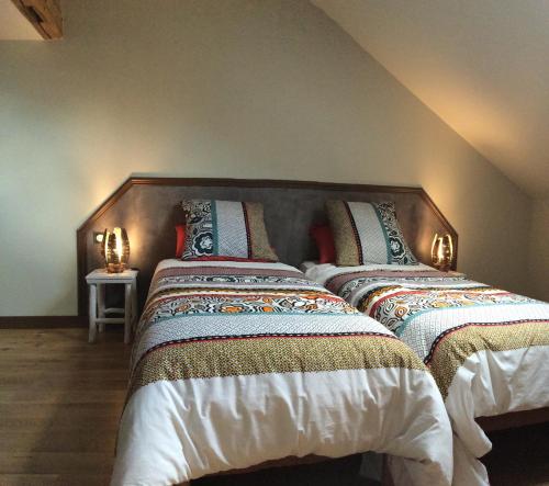 Postel nebo postele na pokoji v ubytování Demeure des Pothières