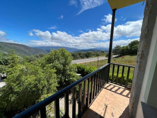 a balcony with a view of a road at A Lastriña in Trives