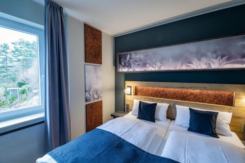 Ένα ή περισσότερα κρεβάτια σε δωμάτιο στο Hotel Hegenbarths