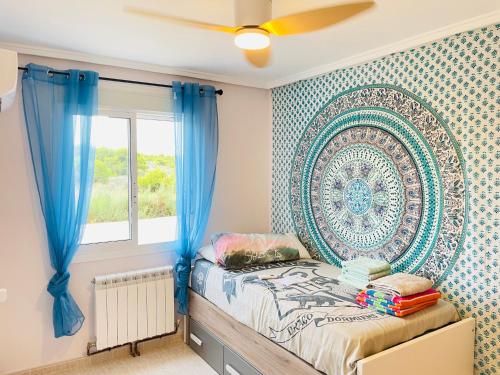 a bedroom with a bed and a large wall art at Casa Azure in Gran Alacant
