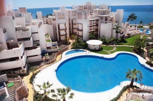 an aerial view of a resort with a swimming pool at Bahía Boutique Apartments in Estepona
