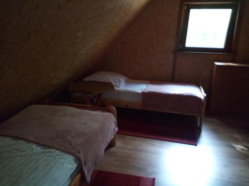En eller flere senger på et rom på Zajazd Przystanek Piławki