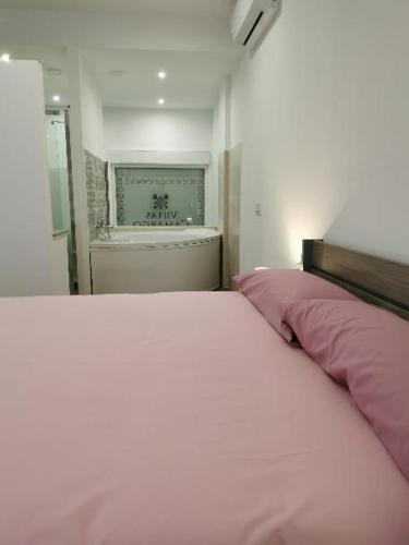Postel nebo postele na pokoji v ubytování Villas Camargo.suites