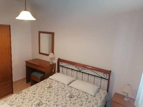 Postel nebo postele na pokoji v ubytování Porto Almira Beachfront Apartrments