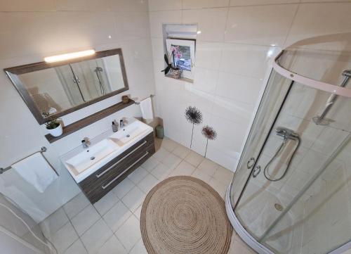 a bathroom with a shower and a sink at Kuća za odmor Sika in Sinj
