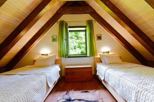 Postel nebo postele na pokoji v ubytování Villa Dobra