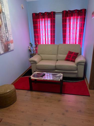 a living room with a couch and a coffee table at Casa do Campo in Cedros