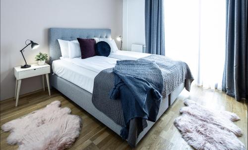 Posteľ alebo postele v izbe v ubytovaní UNIQUE residence with garage