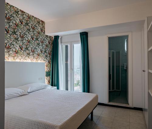 Postel nebo postele na pokoji v ubytování SoleMare Hotel e Residence