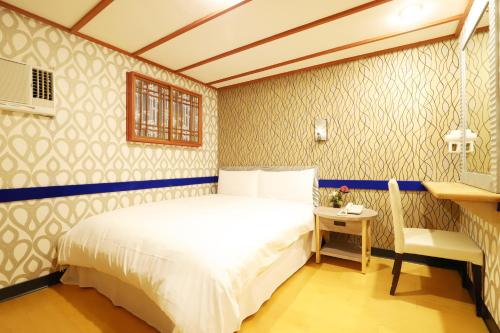 Katil atau katil-katil dalam bilik di Gorgeous Hot Spring Resort