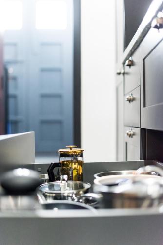 a kitchen counter with dishes on a counter top at Casa Toro Calpe in Calpe