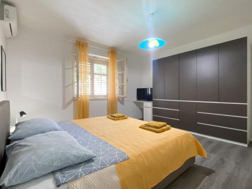 Postel nebo postele na pokoji v ubytování Apartment Dado