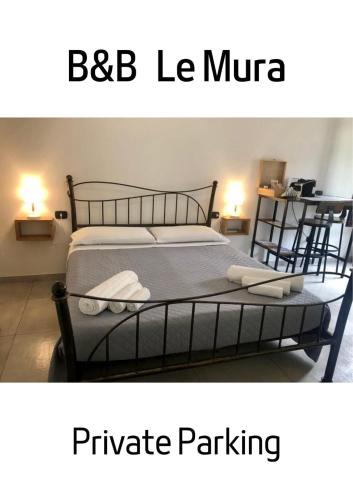 a bedroom with a bed with at le mura in Iglesias