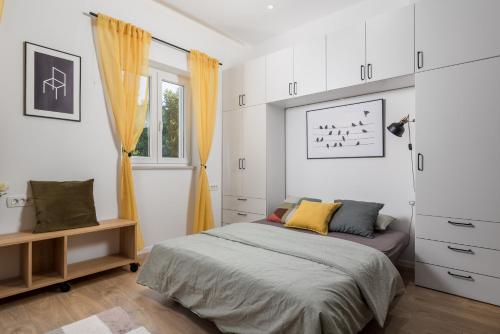 Postel nebo postele na pokoji v ubytování Trsat Central Apartments