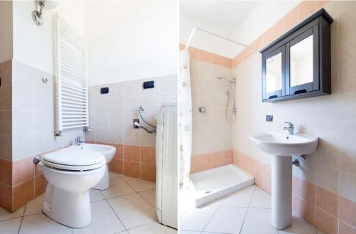 La salle de bains est pourvue de toilettes et d'un lavabo. dans l'établissement Cozy 55-m2 flat close to the countryside in Narni, à Narni