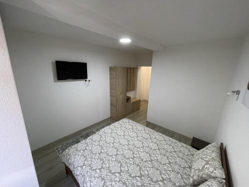 En eller flere senge i et værelse på Vila 5