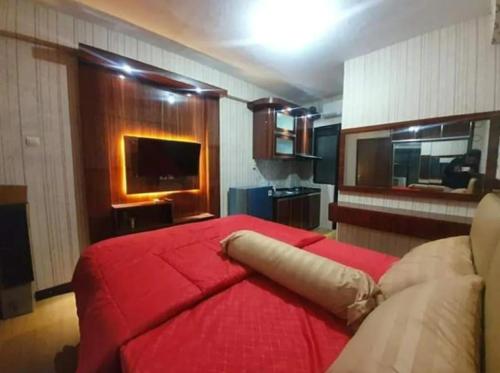 Фотография из галереи OYO 91338 Apartment Bekasi Town Square в городе Бекаси
