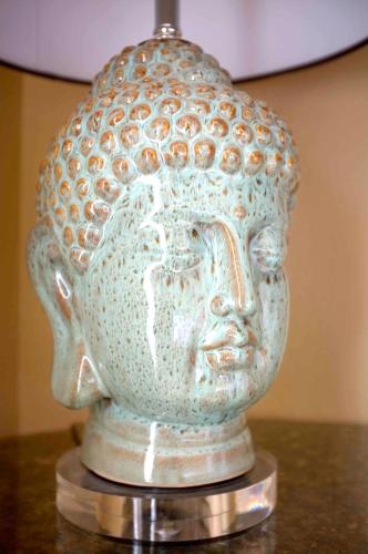 a vase with a face on top of a table at Embrace Calistoga in Calistoga