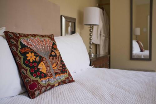 a pillow sitting on top of a bed at Embrace Calistoga in Calistoga