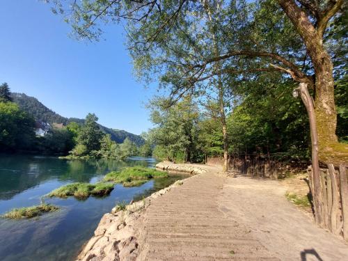 a path next to a river at ATRIUM Holiday home in Bihać