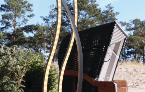 a swing in a park with trees in the background at Baltic in Binz
