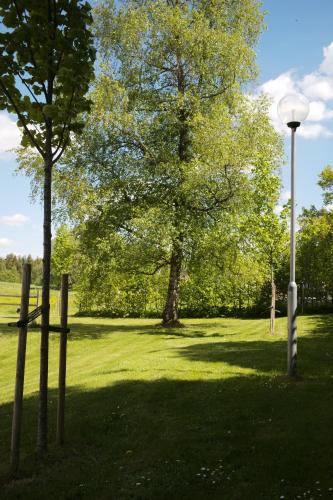 a park with a light pole and trees at Gransäng Loft House in Nässjö